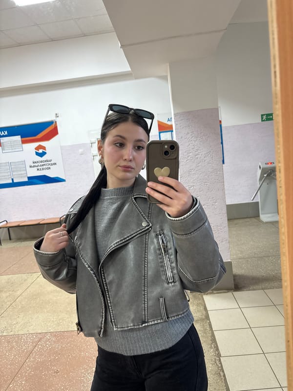 Woman takes mirror selfie in Chaikovsky public building