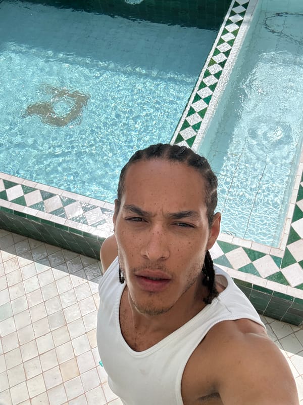 Man poses poolside at Morocco's Mechouar Kasbah