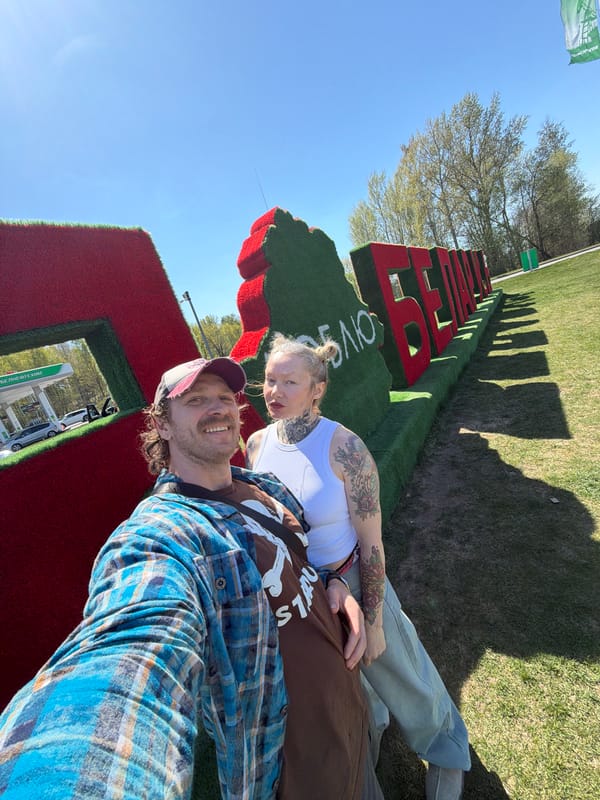 Visitors pose at Belarus topiary installation spelling love message