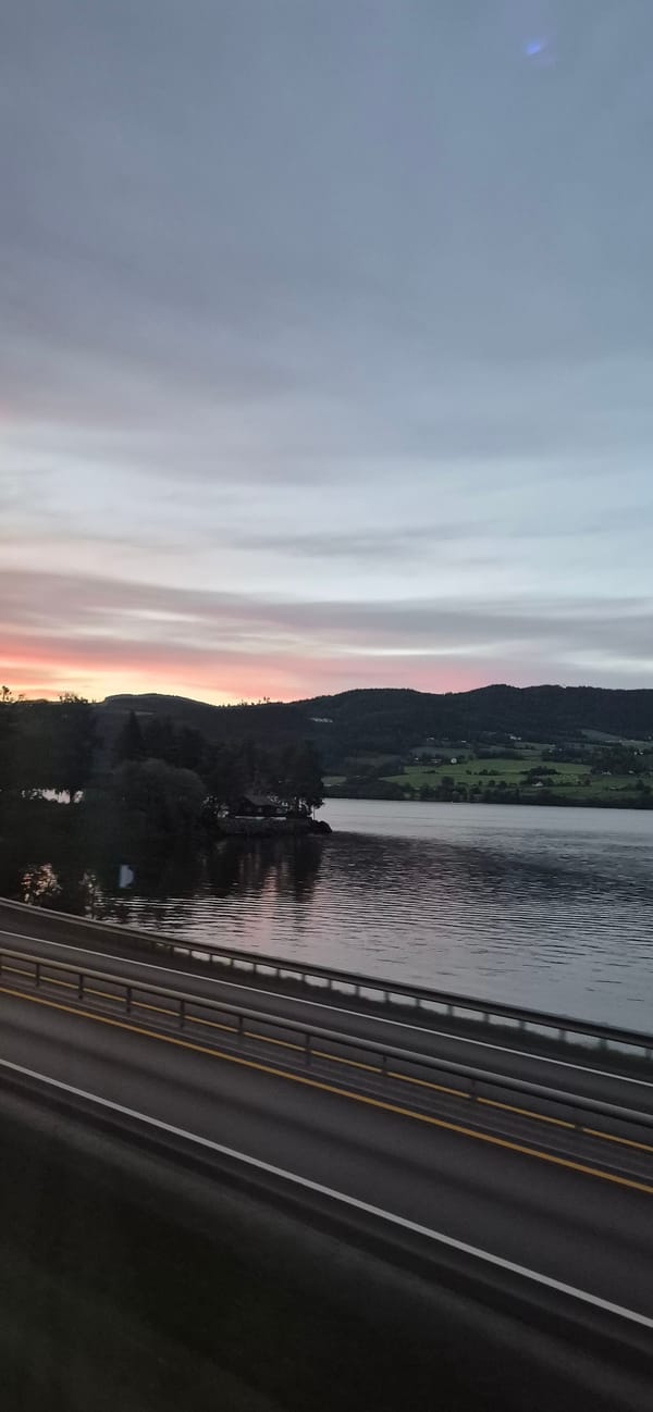 Dusk over Biri — soft sky, power lines, and still water