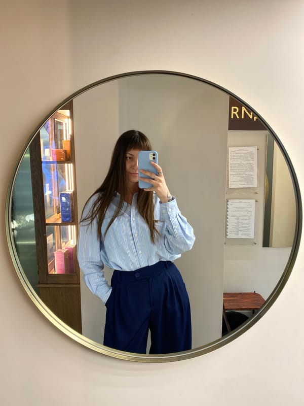Woman takes mirror selfie at Votkinsk retail location