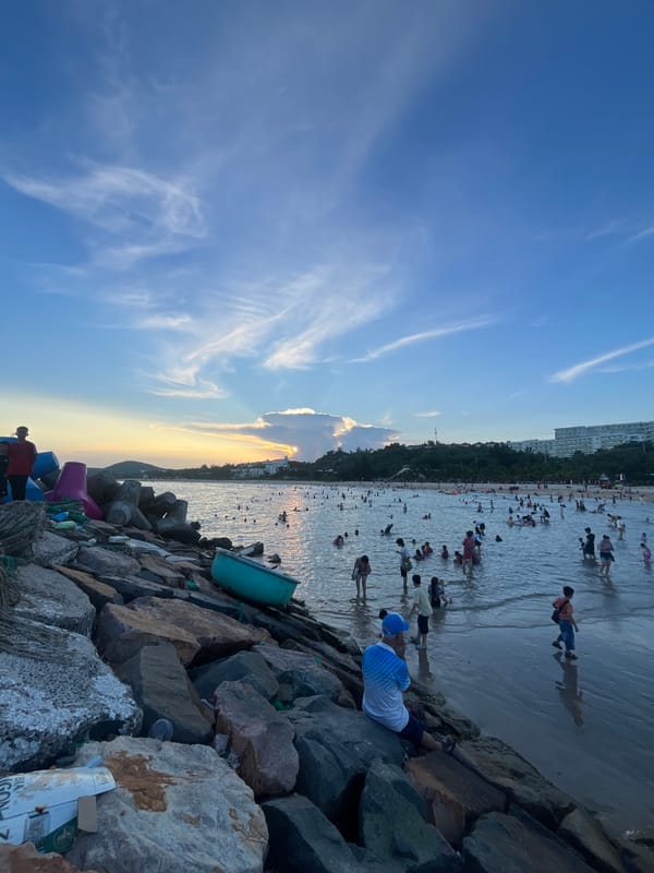 Sunset crowd at Phu Thuy Ward beach, Vietnam
