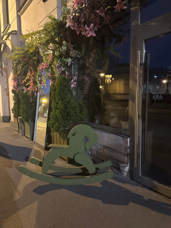 Woman takes selfie near rocking horse in Saint Petersburg