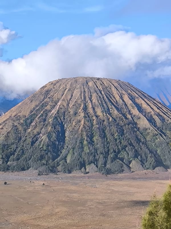 Mount Bromo erupting over the Tengger Caldera, Cemorolawang