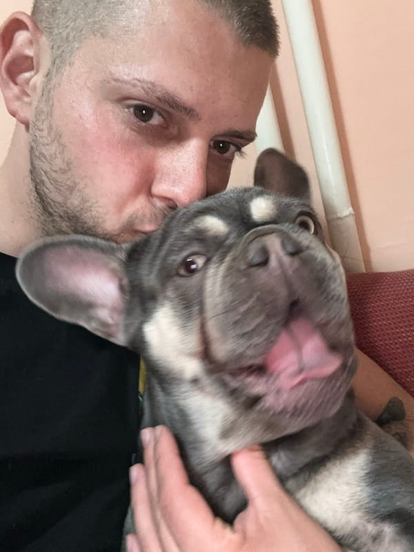 Man shares tender moment with French Bulldog companion