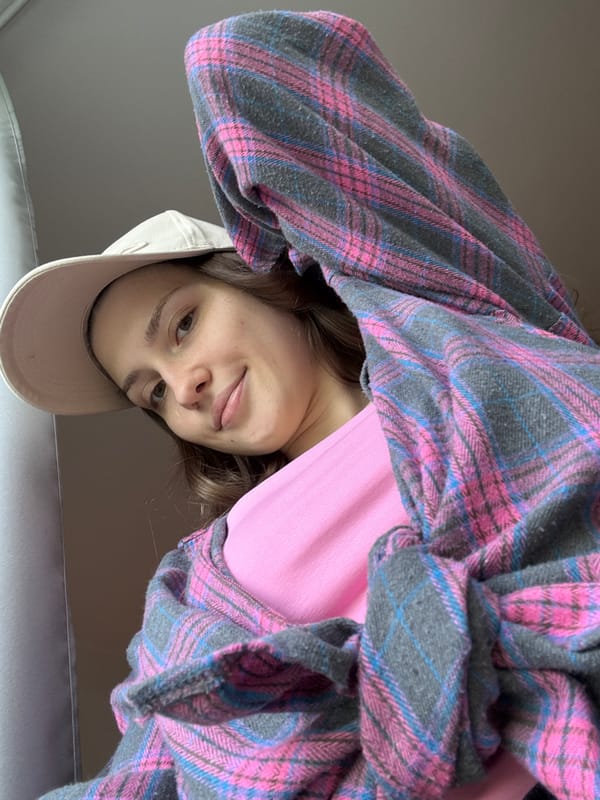 Young woman takes morning selfies, touches plants in Shushary