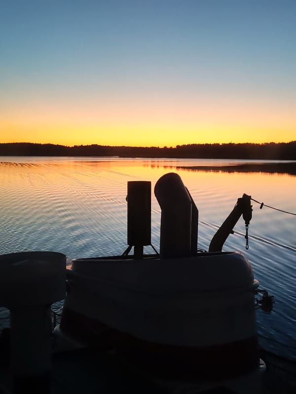 Boat crew captures sunset scenes from vessel bridge