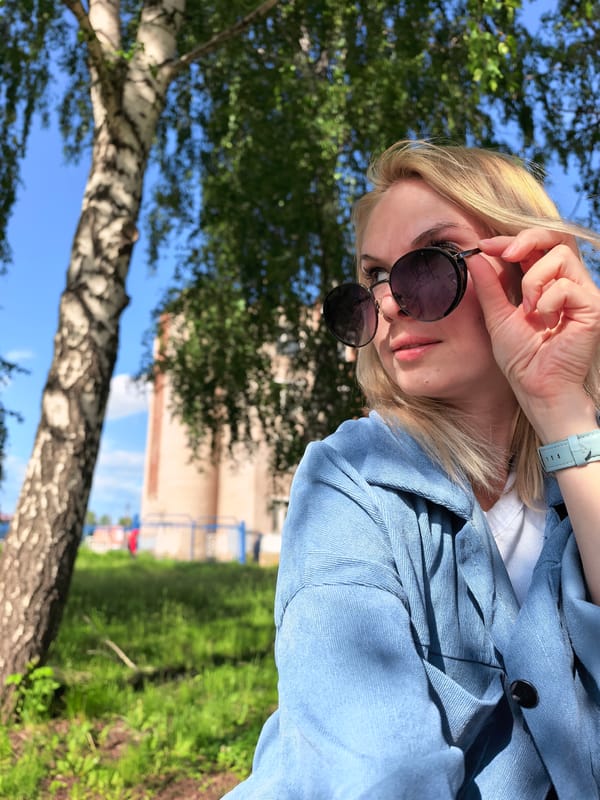 Woman photographs park outing in Sterlitamak, Russia