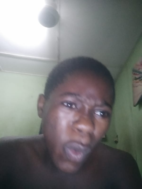Person captures expressive selfie indoors in Shangisha, Nigeria