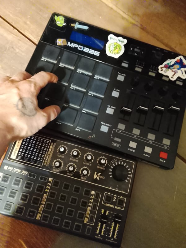 Tattooed musician operates decorated drum machine in Russian village