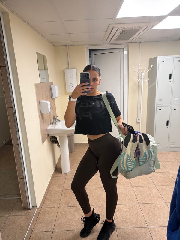 Woman takes multiple selfies in Gabrovo restroom facility