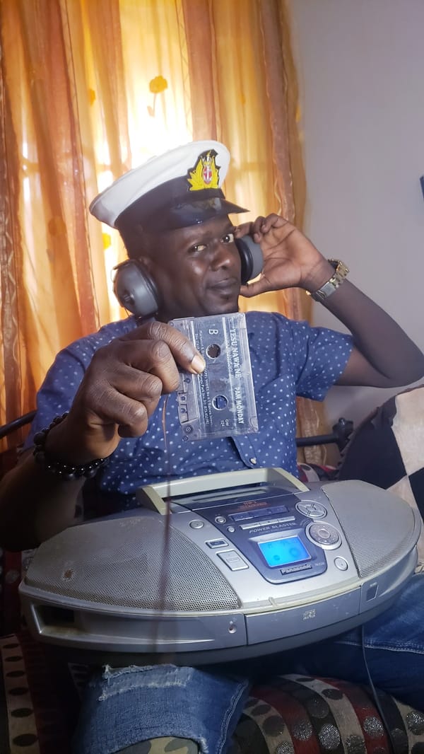 Man enjoys extended cassette listening session in Nigerian home