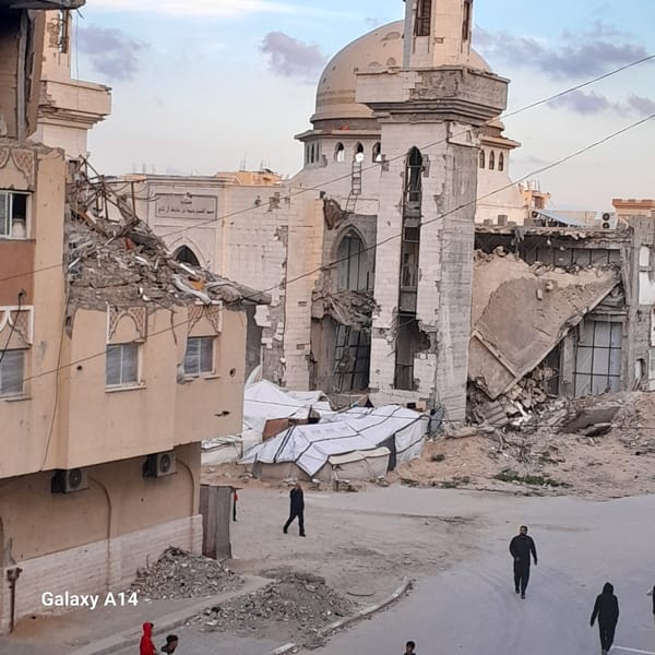 Residents navigate damaged buildings and makeshift settlements in Khan Yunis