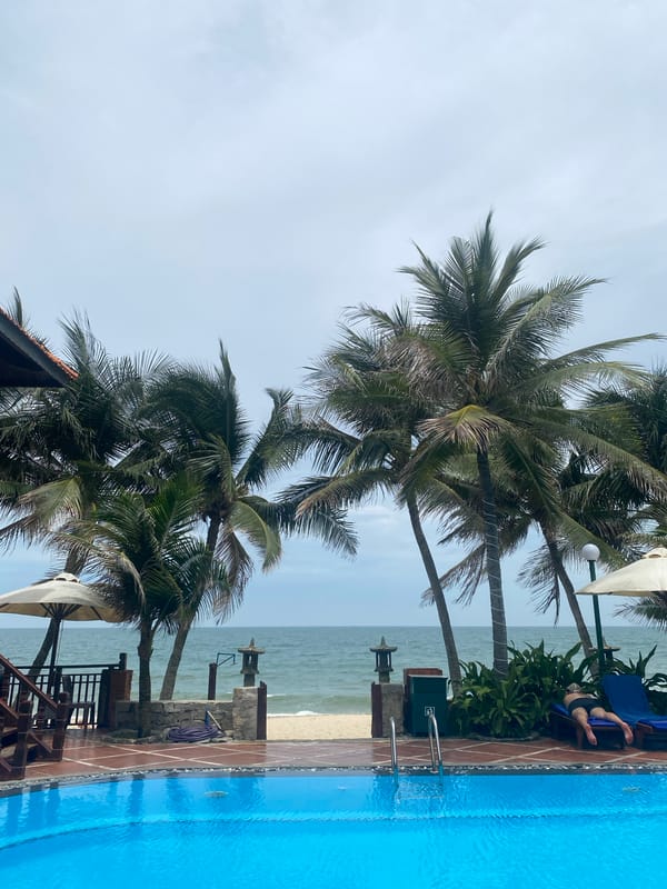 Child enjoys poolside playtime at Vietnamese tropical resort