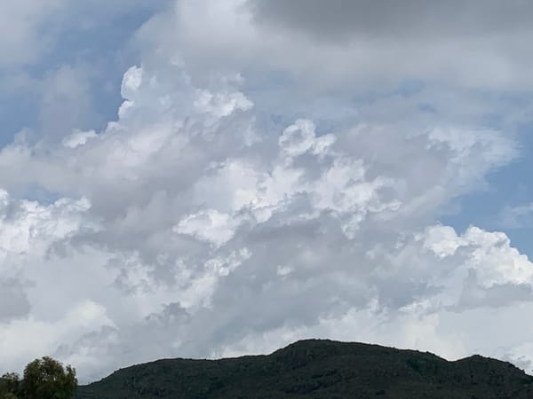 Storm clouds gather over Kuru Karama on a midday in June