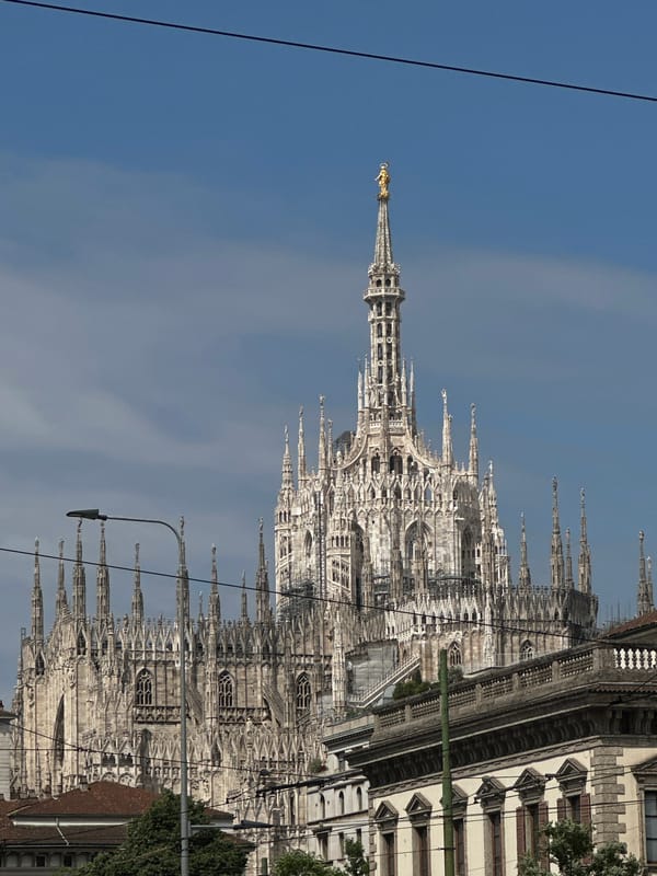 Tourist documents Milan Cathedral and historic architecture during morning walk