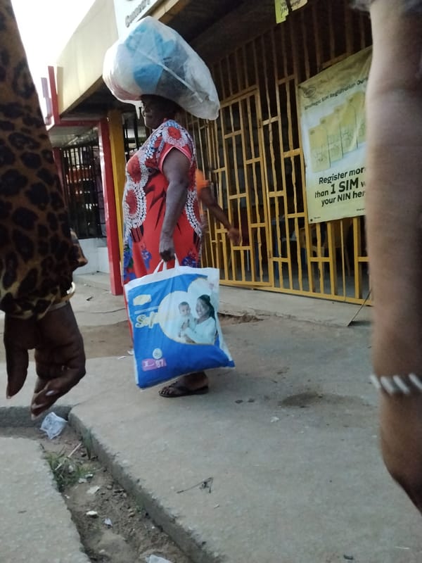 Nigerian street markets buzz with fresh produce vendors