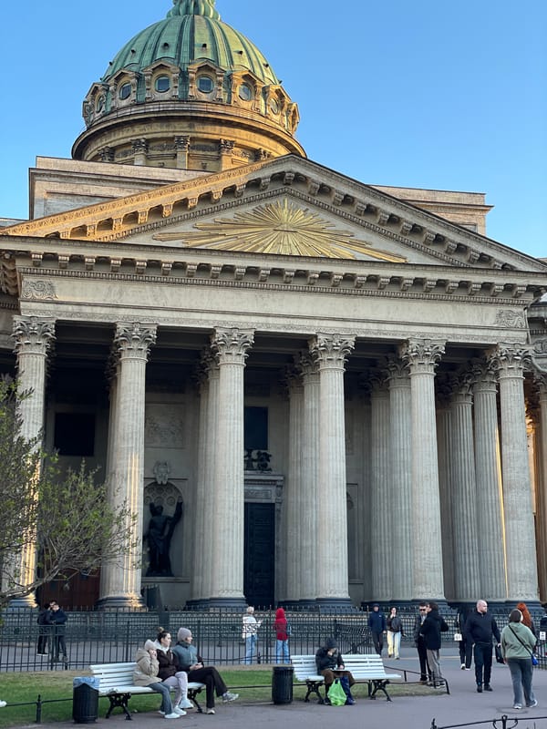 Pedestrians cross street at Saint Petersburg's Kazan Cathedral