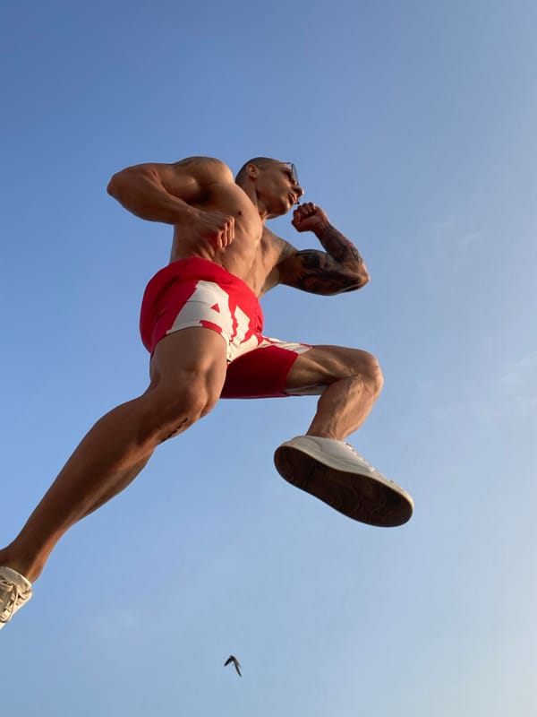 Mid-air jump against a clear blue sky in Pleven