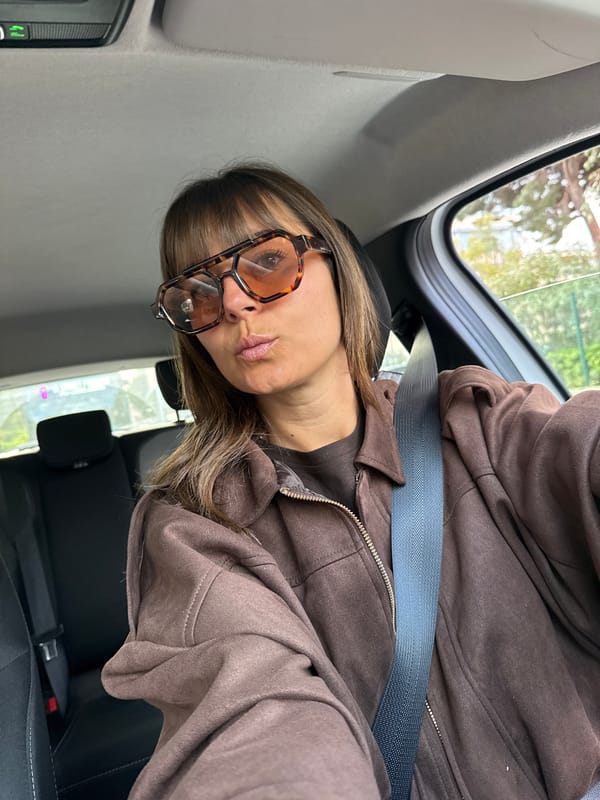 Woman in sunglasses observed in passenger seat in Cannes