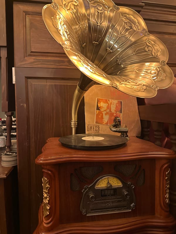 Two women take nighttime selfies on Yerevan street