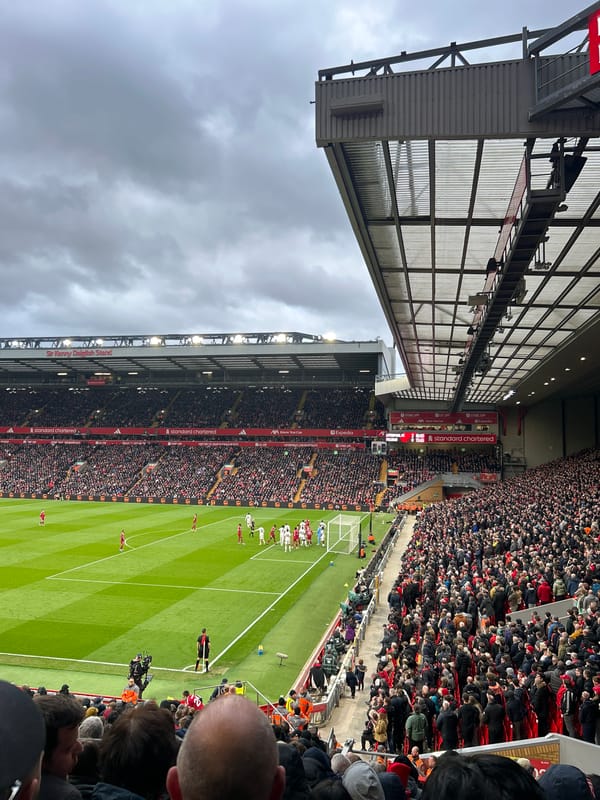 Football match draws packed crowd at Liverpool's Anfield Stadium