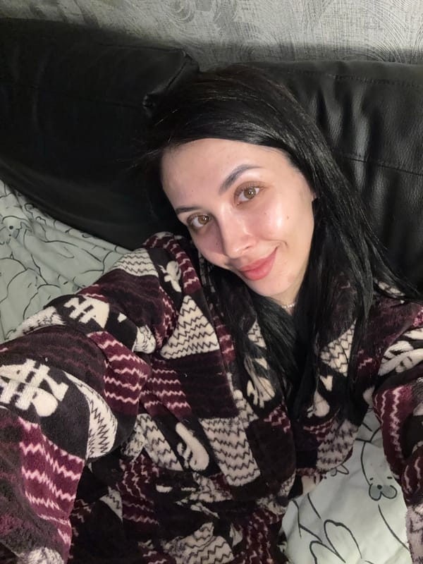 Woman plays with Sphynx cat in Votkinsk apartment