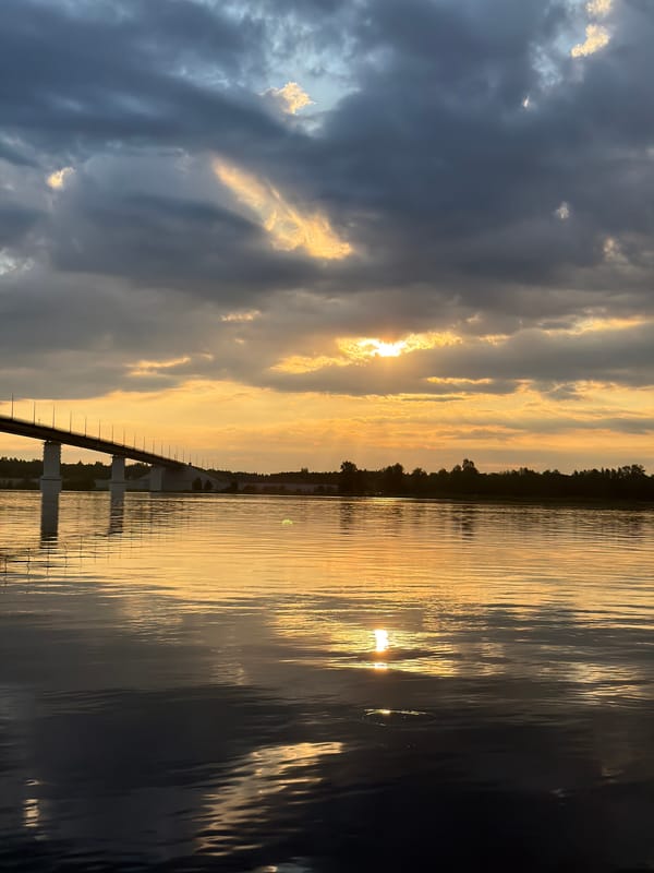 Sunset gathering on the Kama River below Kambarka's bridge