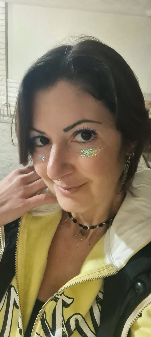 Woman takes selfie in Nahariyya with distinctive makeup and piercings