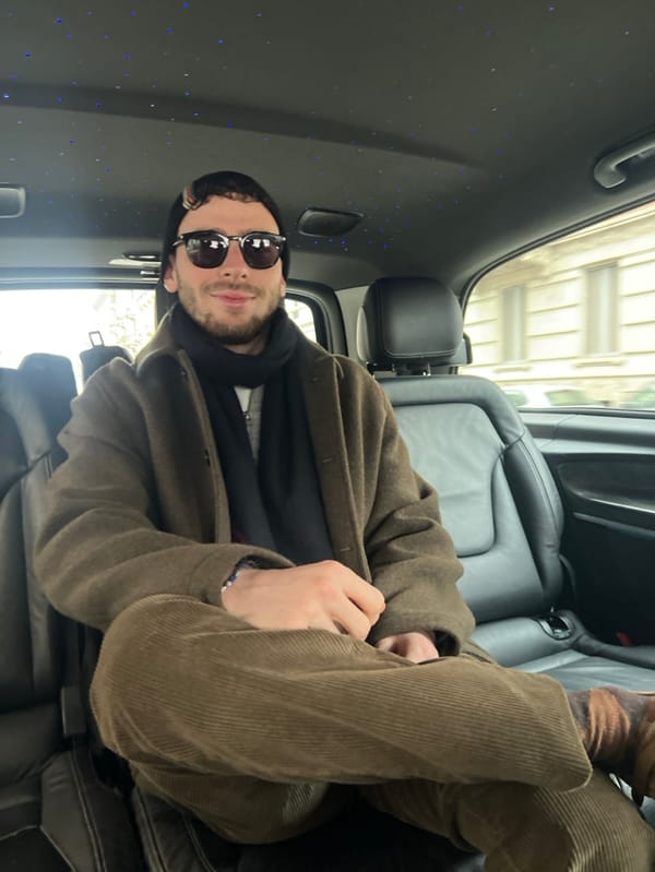 Two passengers observed in luxury vehicle in Milan