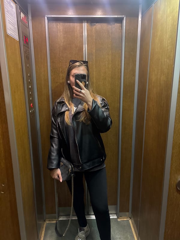Woman takes selfie in elevator in Kharkiv, Ukraine