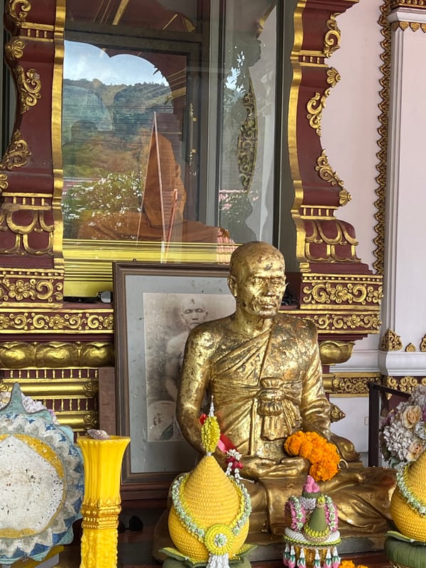 Mummified monk and golden shrines inside a Ko Samui temple