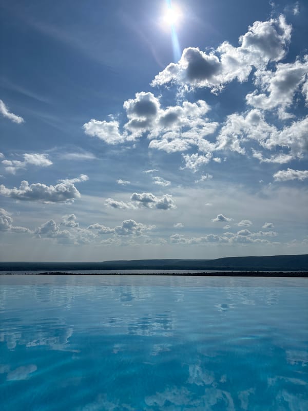 Sunny afternoon at a poolside overlooking the Novokuybyshevsk riverfront