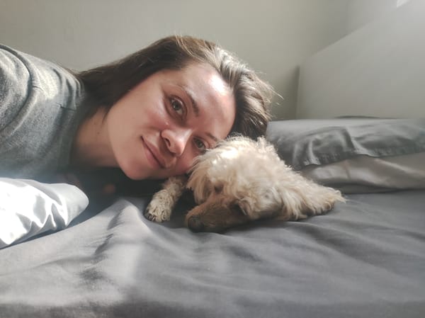 Woman and dog share quiet morning moments in Chaikovsky