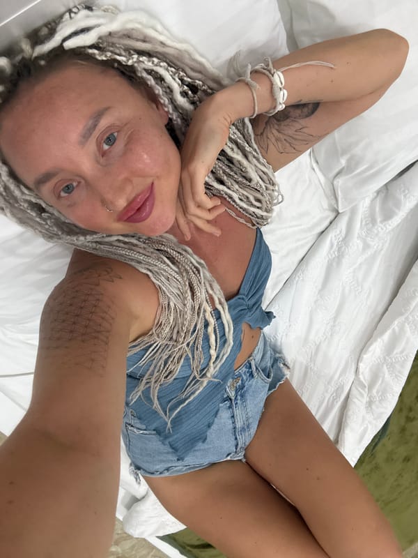Lounging on a hotel bed in Nha Trang, Vietnam