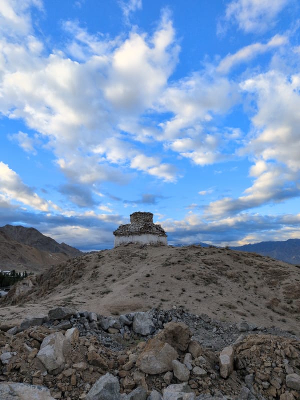 Stupas, statues, and open roads in Leh's high-altitude landscape