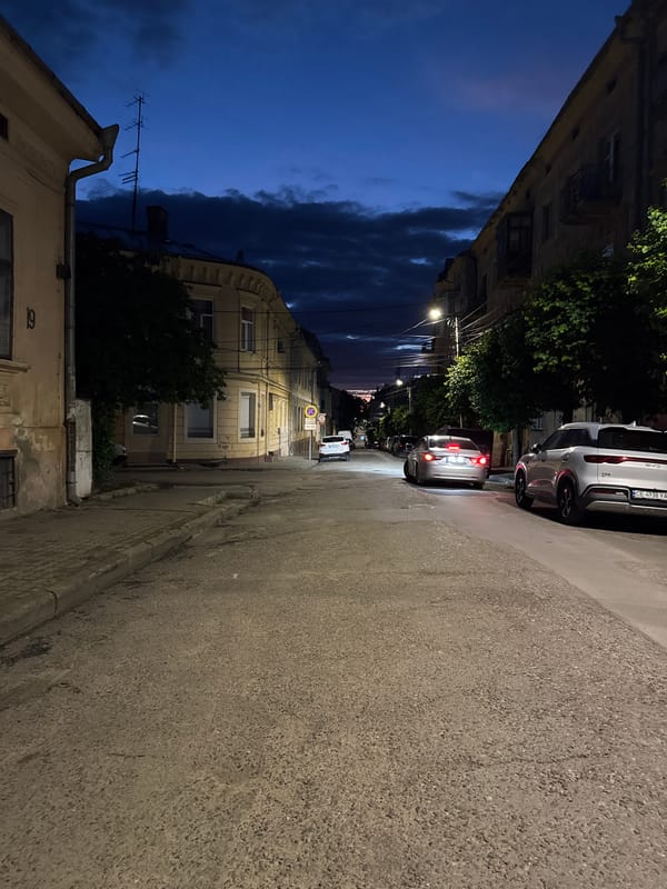 Dusk settles over a quiet Chernivtsi street