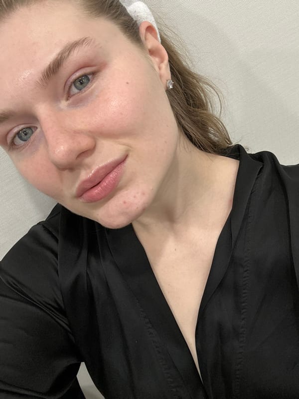 Woman Documents Evening Skincare Routine in Kazan Bathroom