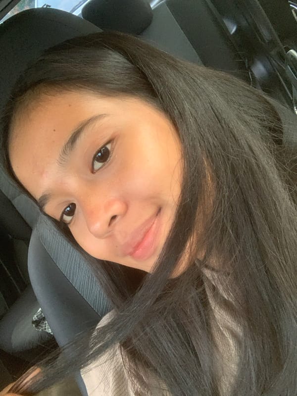 Young woman photographed in vehicle, Samarinda Indonesia morning
