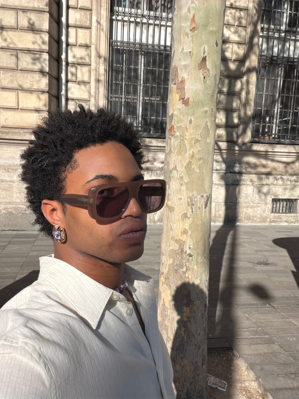 Person in striped shirt spotted near sycamore tree in Paris