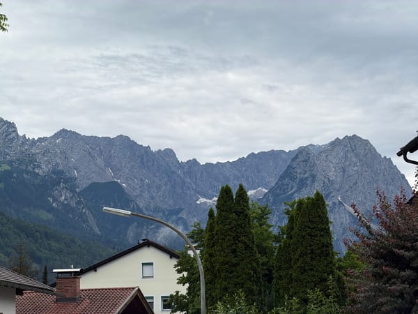 Alpine peaks and rooftops in Garmisch-Partenkirchen on a cloudy afternoon