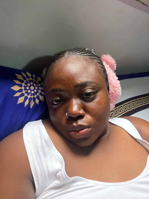Lazy afternoon bedroom moments in Abuja with phone and plushie