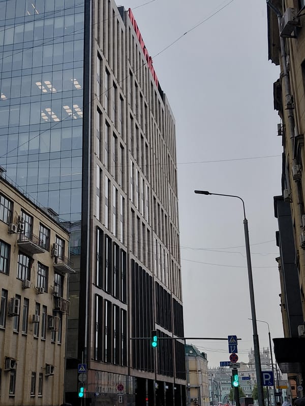 Rainy day on Moscow streets, electric buses and umbrellas out