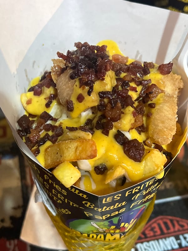 Late-night diners enjoy french fries at outdoor restaurant in Arica