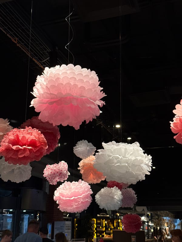 Pastel pom-pom décor and a pink blended drink in Krasnoyarsk