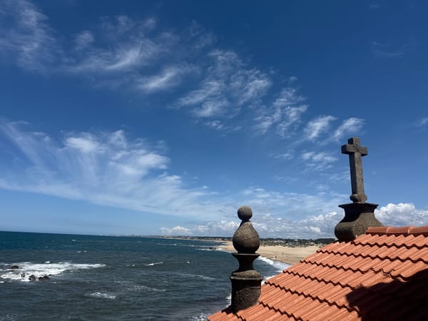 Tourist documents church and coastal scenery in Vila Nova de Gaia