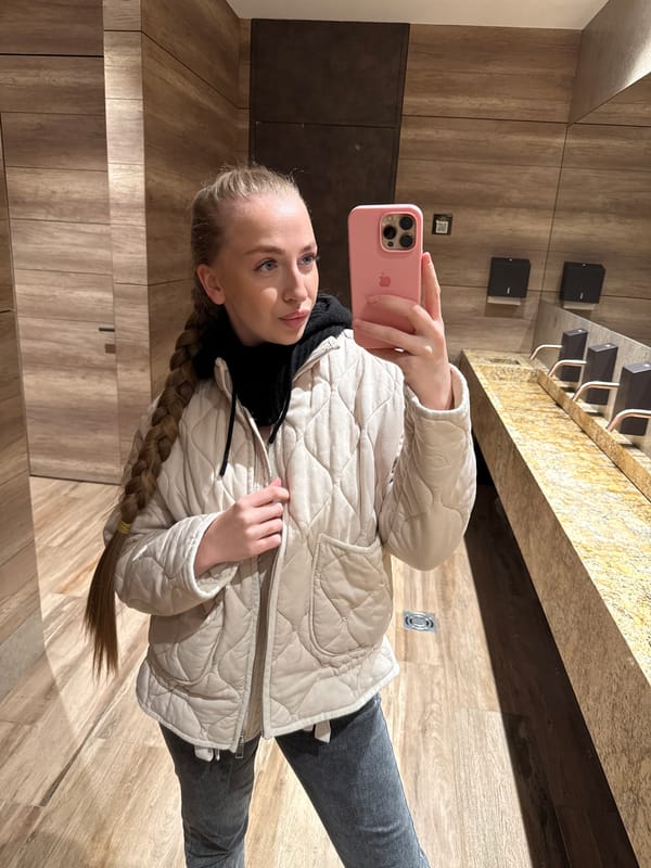 Woman Takes Mirror Selfies in Bathroom During Early Morning Hours