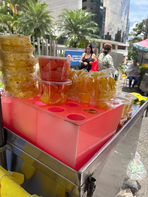 Fruit vendor operates cart on Medellín street