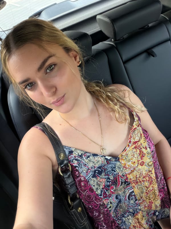 Woman rests in vehicle back seat in Miami