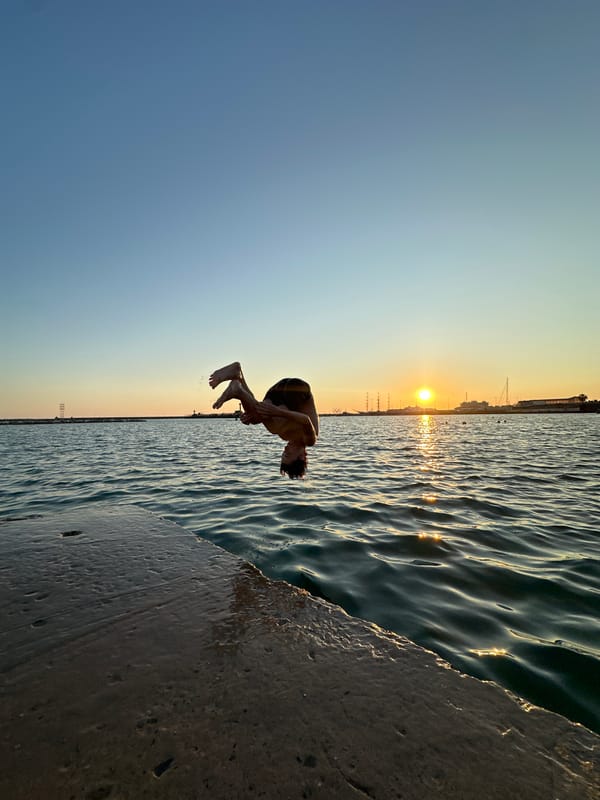 Backflips off a Sochi sea ledge at sunset